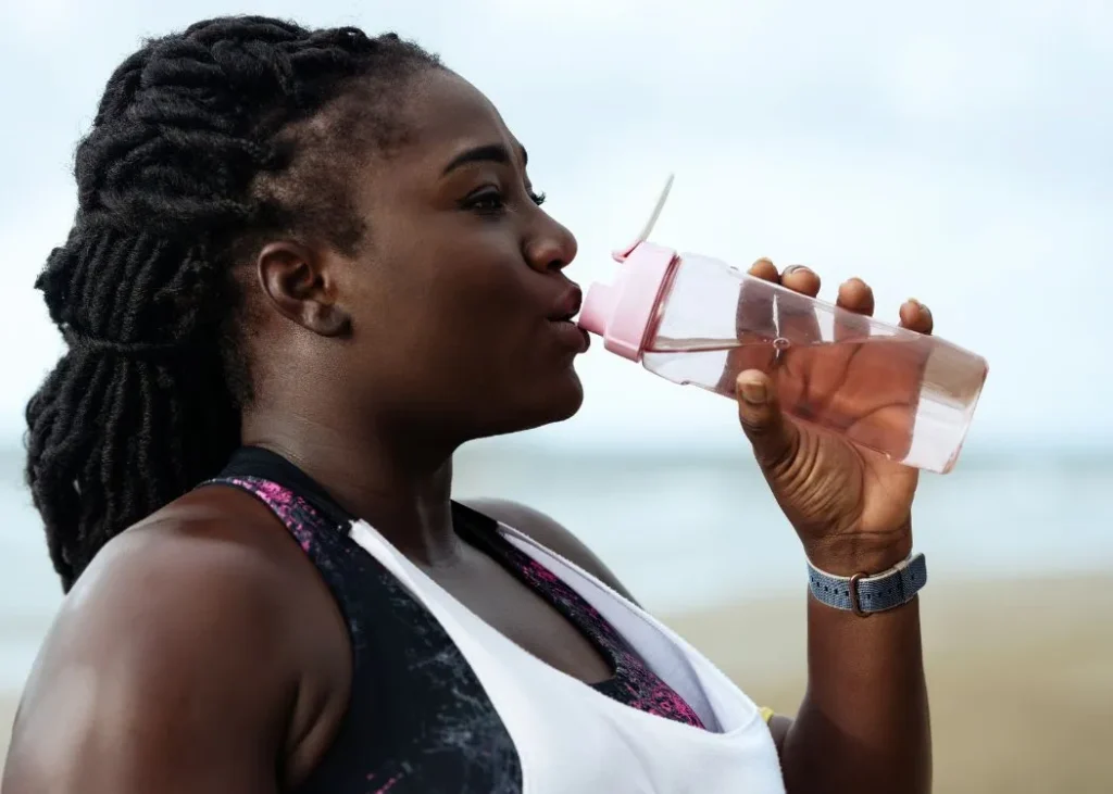 woman drinking water after bariatric surgery